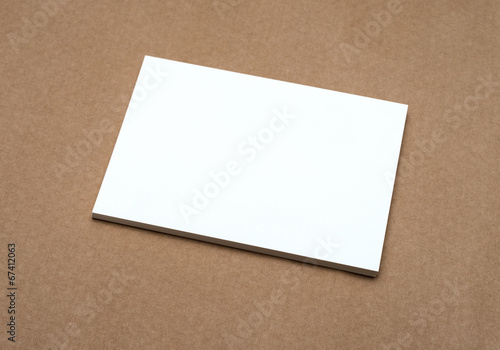Stack of blank white business cards on crafts background
