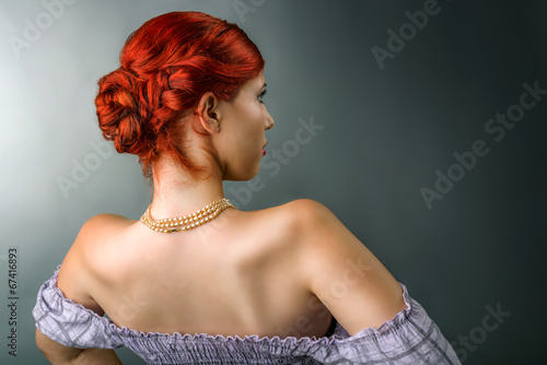 Young woman with elegant braided hairstyle