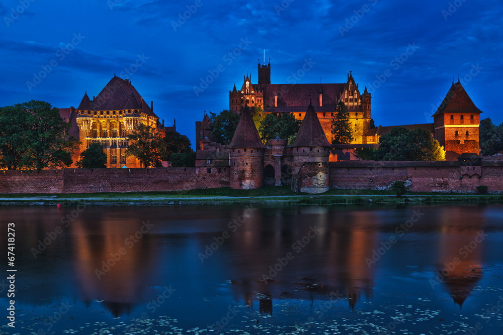 HDR image of medieval castle in Malbork at night