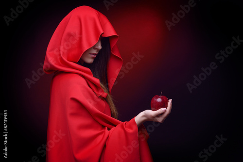 beautiful woman with red cloak holding apple