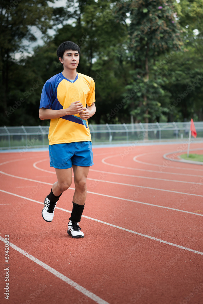 Fototapeta premium Asian athlete on the track