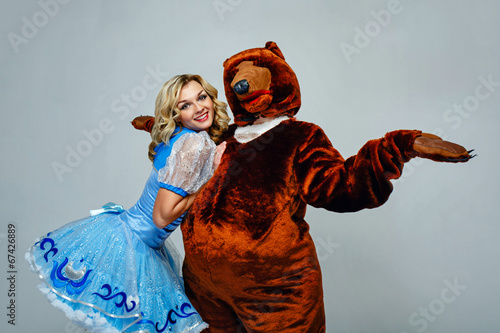 Attractive young girl and bear