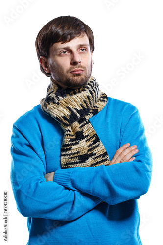 Young man wearing scarf and sweater photo