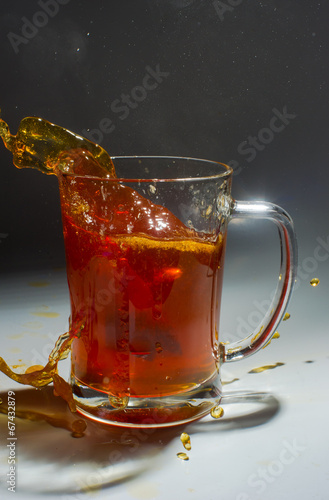 Tea filter splashes into glass