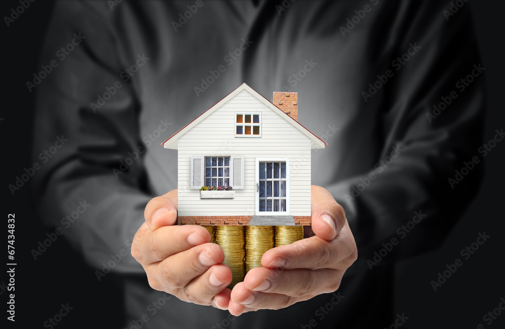 holding house representing home ownership holding house representing home ownership