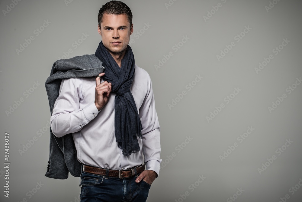 Handsome young man in casual jacket and neck scarf Handsome young man in casual jacket and neck scarf