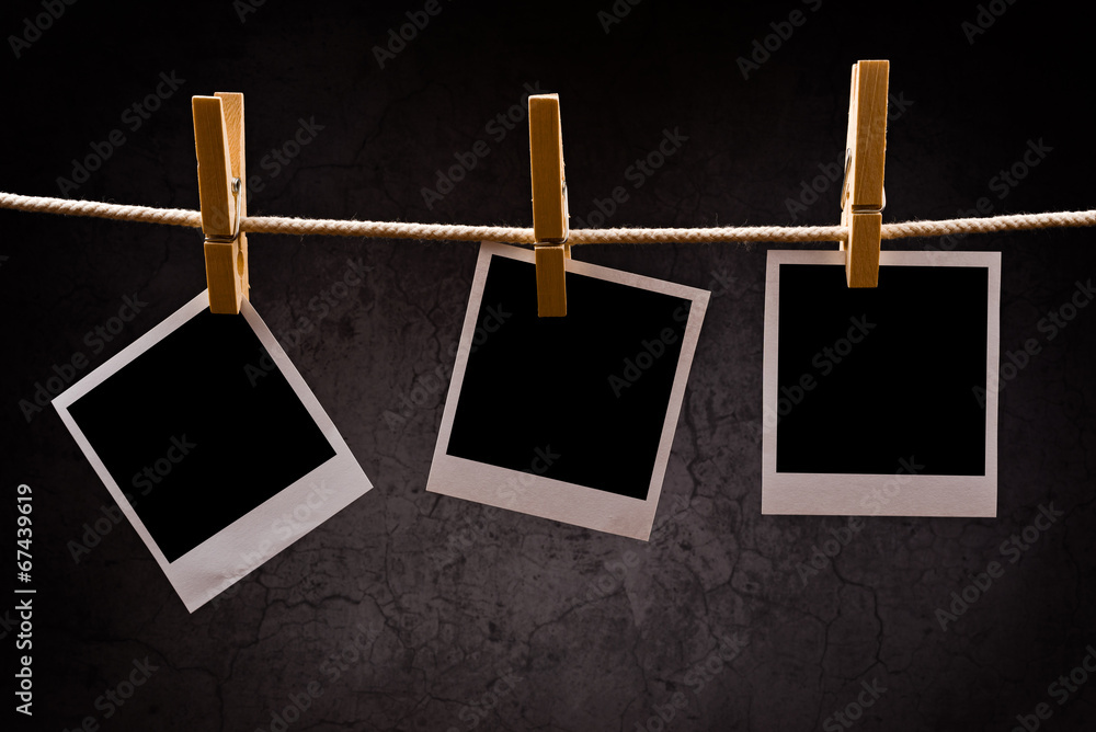 Photography paper with instant photo frames attached to rope wit Photography paper with instant photo frames attached to rope wit