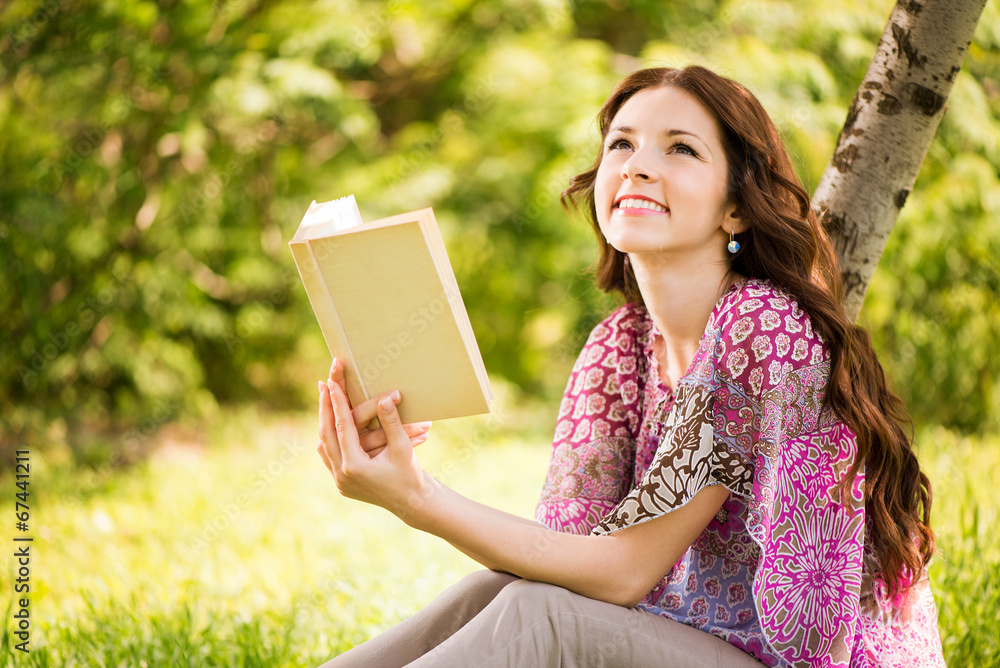 Girl with a book in the park Girl with a book in the park