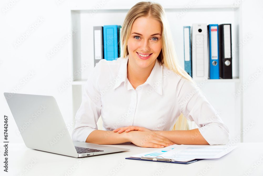 Business woman using laptop at office Business woman using laptop at office