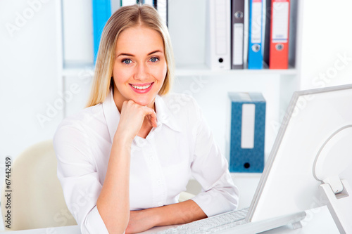 Business woman using laptop at office