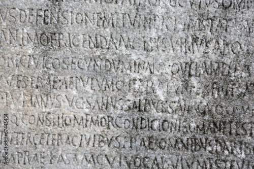 Ancient Greek writing chiseled on stone