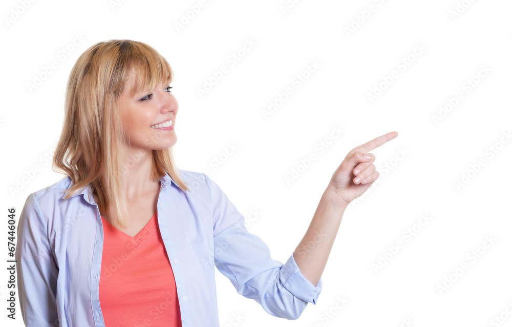 Attractive woman with dark eyes looking and pointing sideways Attractive woman with dark eyes looking and pointing sideways