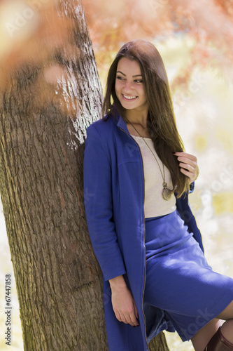 Young woman in autumn forest