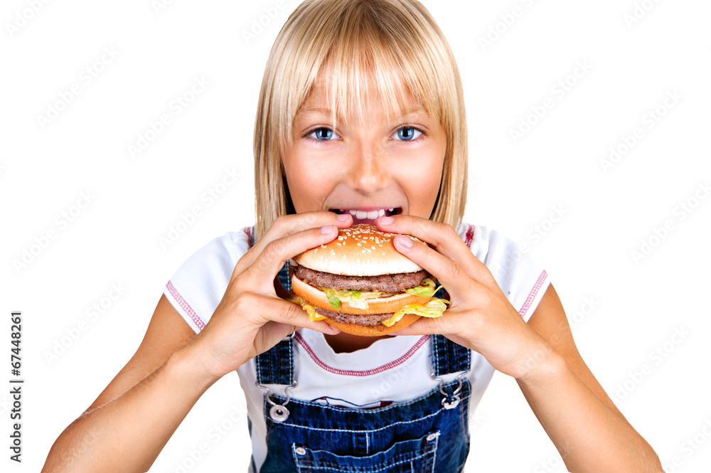 Pretty little girl eating a hamburger isolated on white Pretty little girl eating a hamburger isolated on white
