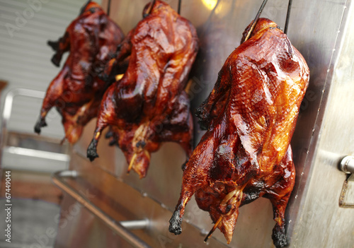 close up chinese roasted duck in restaurant photo