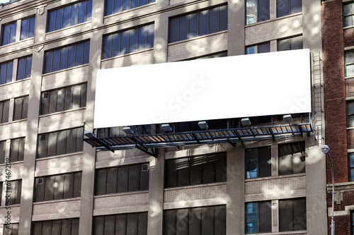 Big, horizontal, billboard on the building wall.