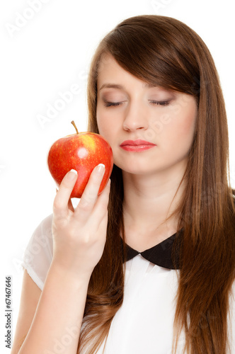 Diet. Girl smelling apple seasonal fruit.