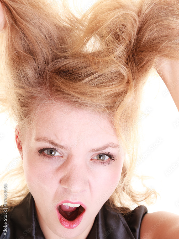 Naklejka premium Angry furious woman screaming and pulling messy hair