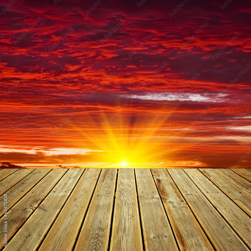 Wooden deck floor and sunset sky Wooden deck floor and sunset sky