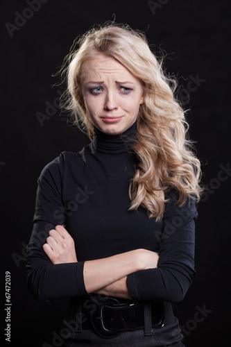 Upset crying woman. tragic expression. © kopitinphoto