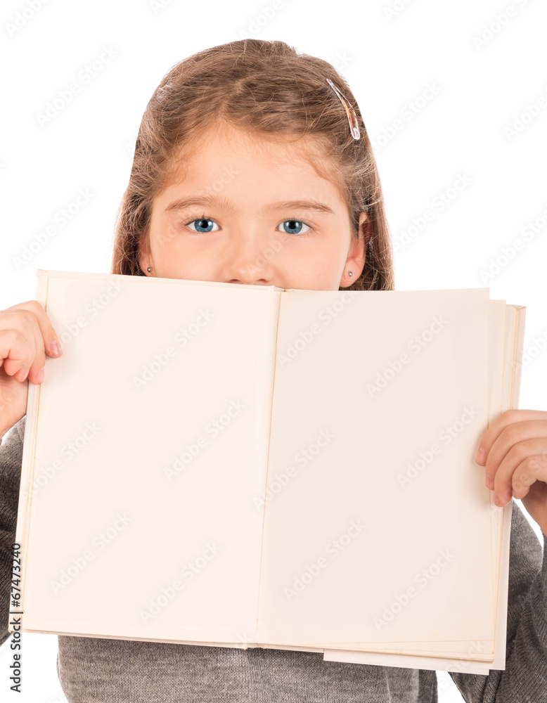Little girl peeking from behind an open book Little girl peeking from behind an open book