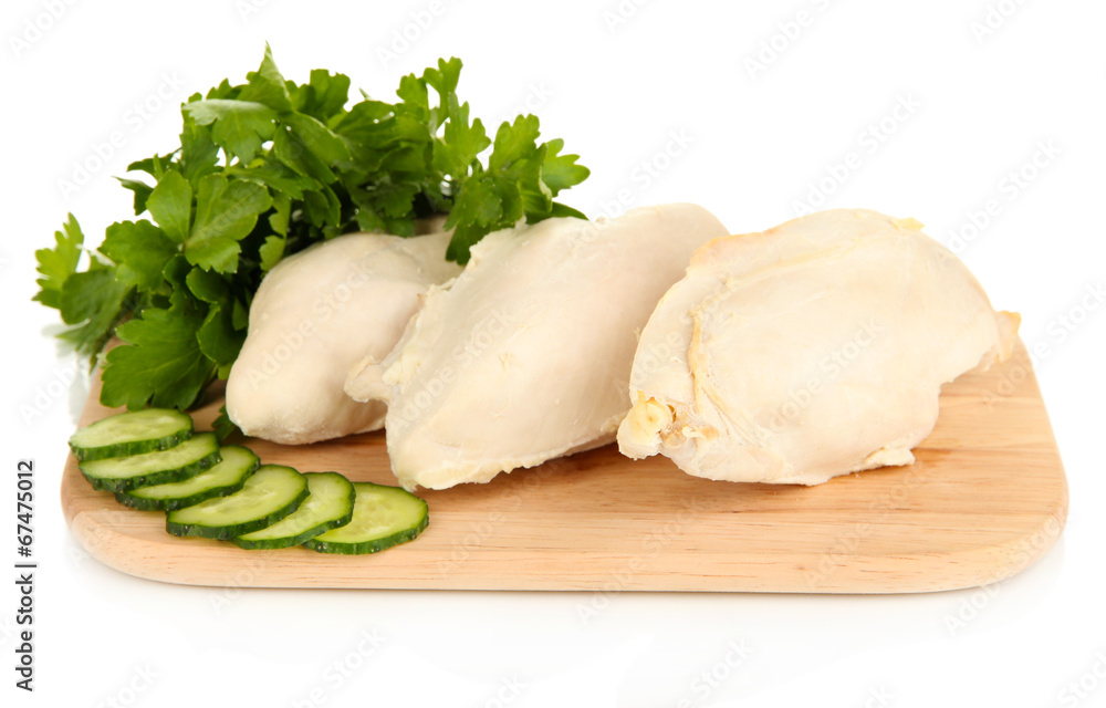 Boiled chicken breast on wooden cutting board isolated on white Boiled chicken breast on wooden cutting board isolated on white
