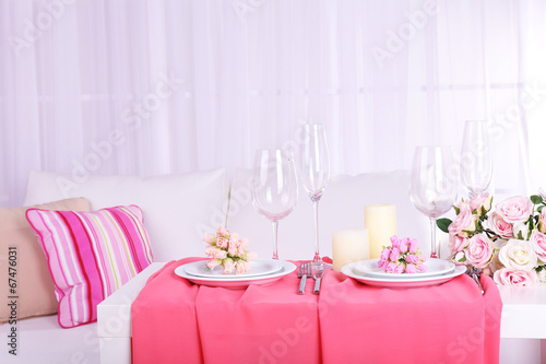 Festive table setting in interior © Africa Studio