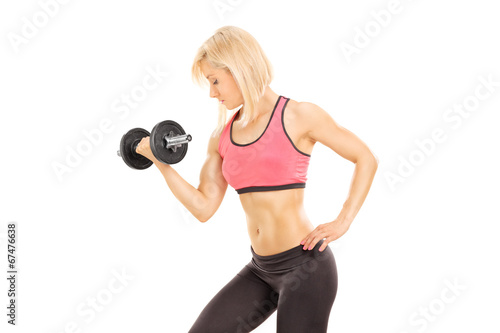 Female athlete exercising with a barbell