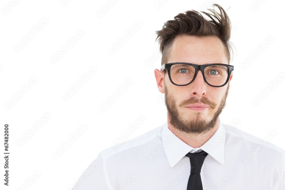 Geeky young businessman looking at camera Geeky young businessman looking at camera