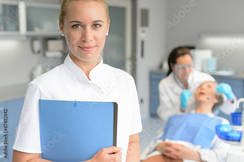 Fototapeta Naklejka Na Ścianę i Meble -  Dental assistant dentist checkup woman patient