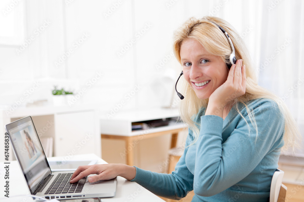 Young attractive woman blonde chatting on laptop Young attractive woman blonde chatting on laptop