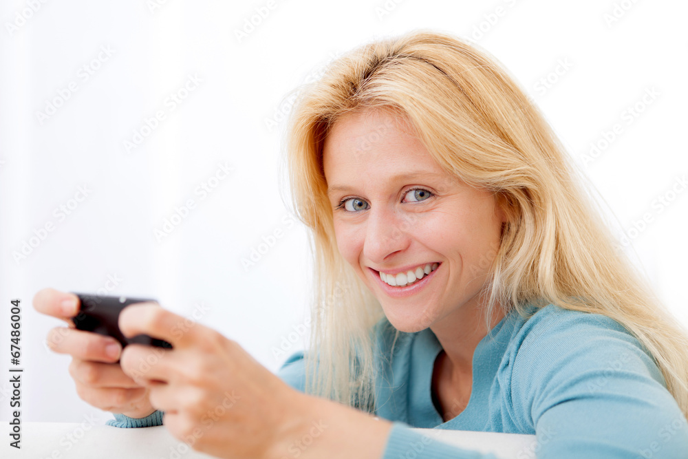 View of Young relaxed woman sending text View of Young relaxed woman sending text