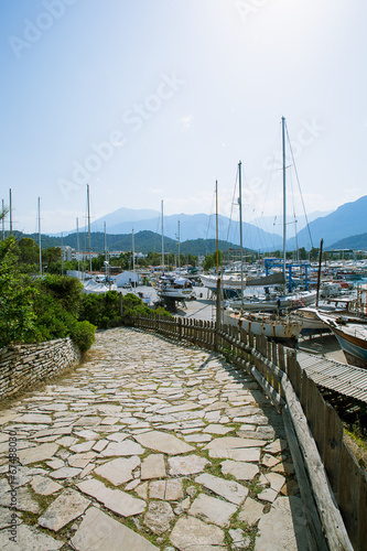 Way to the sea port on mountains background