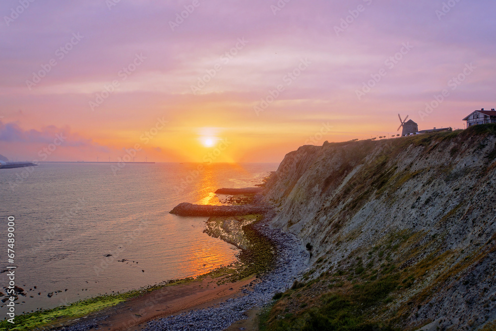 sunset on the sea with Aixerrota mill sunset on the sea with Aixerrota mill