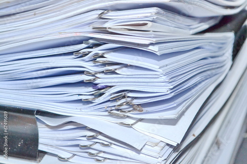 Pile of documents stack up high waiting to be managed