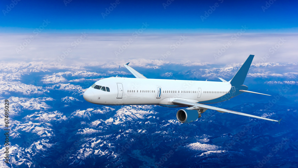 Fototapeta premium Airplane over the clouds