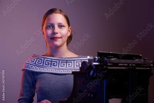 Teen girl sitting at table