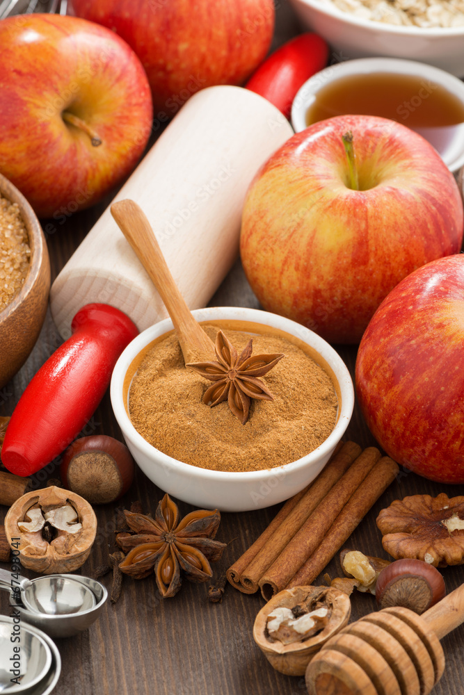 ingredients and spices for baking apple pie, top view, vertical