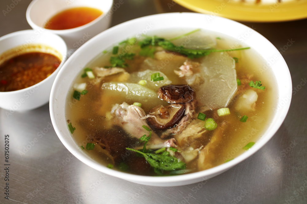 close up chinese chicken soup and vegetable soup in white bowl close up chinese chicken soup and vegetable soup in white bowl