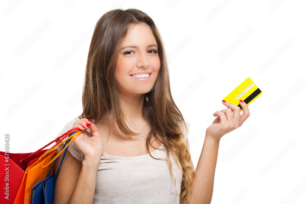 Beautiful woman doing shopping and showing a credit card Beautiful woman doing shopping and showing a credit card
