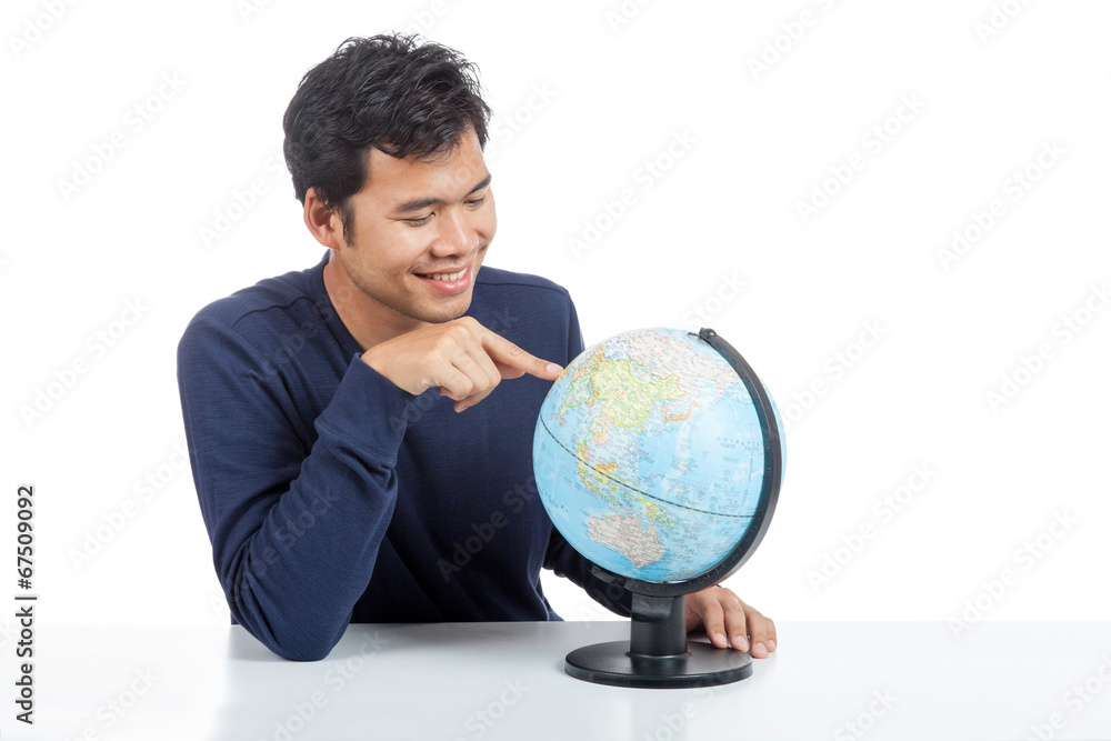 Asian man searching on a world globe Asian man searching on a world globe
