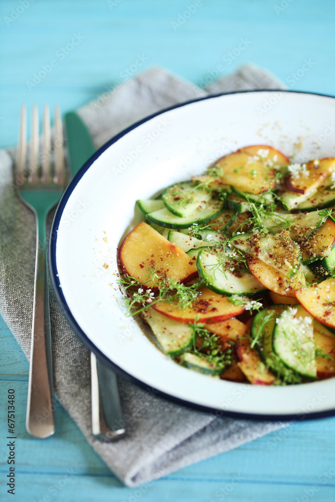 Peach, cucumber summer salad with spices, elderflower, appetizer Peach, cucumber summer salad with spices, elderflower, appetizer