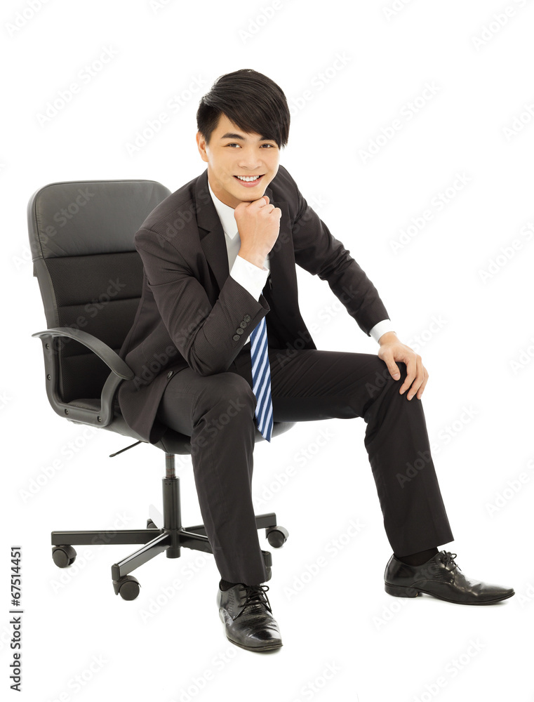 Young smart business man sitting in a chair Young smart business man sitting in a chair