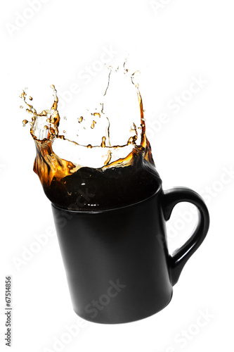 splashing coffee in a cup photo