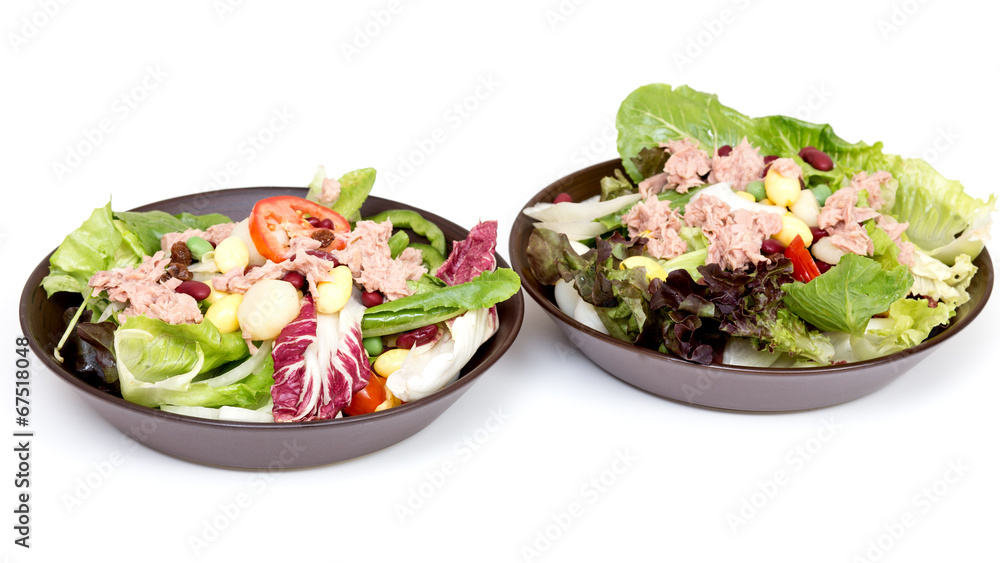 Plate with salad on white table Plate with salad on white table