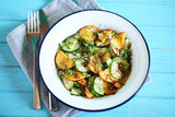 Summer salad with cucumber, peaches and elderberry flower