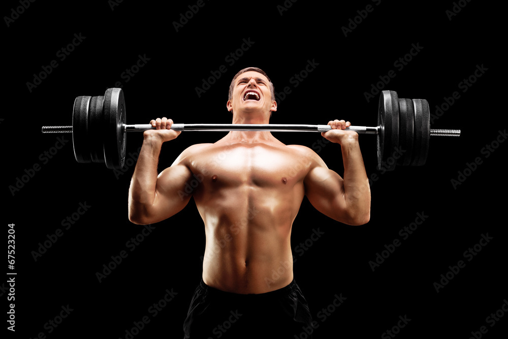 Handsome sportsman lifting a heavy weight Handsome sportsman lifting a heavy weight