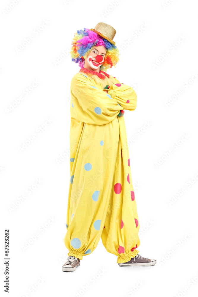 Funny male clown in a yellow costume
