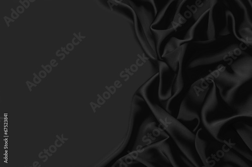Black silk textile background with copy space
