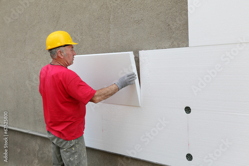 Styrofoam, polystyrene thermal insulation of house wall install photo